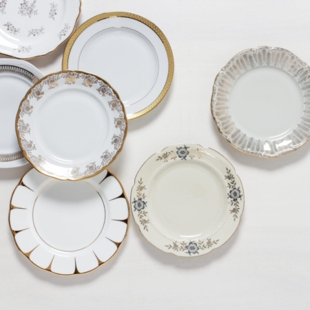 Dessert Plate Margarita Gold Mismatching | The Margarita dessert plate series consists of chic vintage plates. The plates are made of white or ivory-coloured porcelain and decorated with wonderful gold decorations.The combination of golden, playful patterns and elegant lines make this series so special.Whether in a comfortable armchair, at an entertaining wedding party, at a long party table or outside in the shade during a birthday - the Margarita cake plates give a harmonious picture everywhere. | gotvintage Rental & Event Design