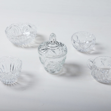 Sugar Bowl Beatrisa Crystal | Our sugar bowls made of sparkling crystal glass with sophisticated ornaments are a beautiful eye-catcher on the coffee table. They are not only perfect for loose sugar and sugar cubes, but also for small sweets such as chocolate mocha beans, pralines or macarons.Alongside the sugar bowls we offer matching milk and cream jugs and crystal glass vases and bowls. | gotvintage Rental & Event Design