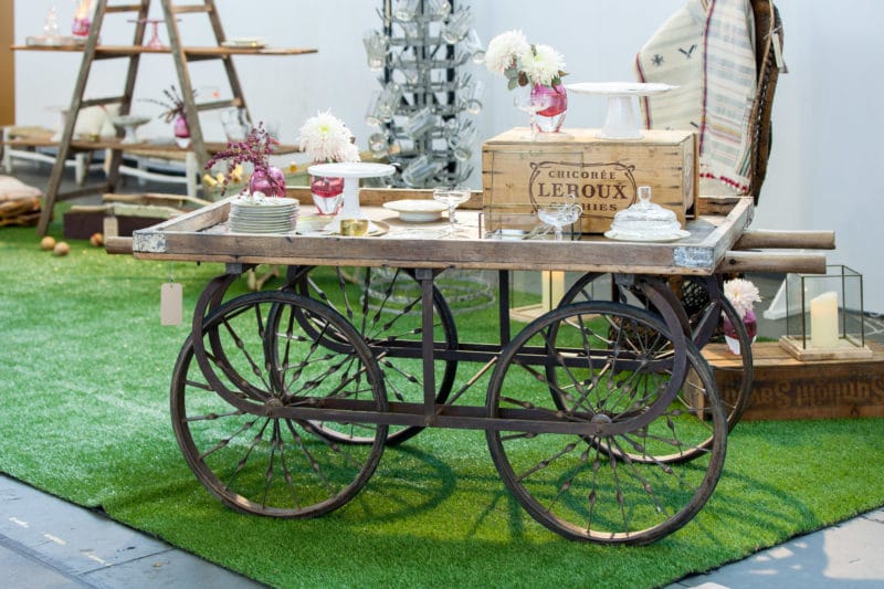  | The antique Anselmo wooden trolley is perfect for presenting products, decorating flowers, placing dishes or serving cakes. The handcart made of wood is robust, stable, mobile and really beautiful. Many of our customers rent the wooden trolley for their garden party or wedding to serve cakes or food presentation. The wooden trolley does a great job for product presentations on trade fair stands and exhibitions | 