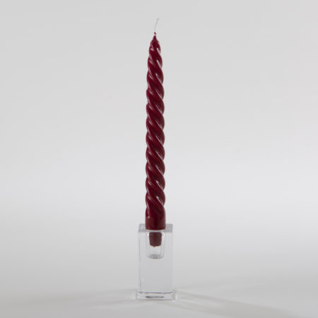 Shiny Twisted Candle Castellanos Bordeaux | This twisted candle in Glitz Bordeaux   attracts all eyes with its minimalist, twisted design. Somehow, it is more than just a candle, almost a small object of art that not only looks great on the table but also as an eye-catcher on sideboards or bar trolleys.Our spiral candles are carefully made by hand in a traditional manufactory in Italy.  The softly shaped candles look particularly good in our “Rivadavia” candle holders made of clear glass.We exclusively offer candles for sale, not for rent. | gotvintage Rental & Event Design
