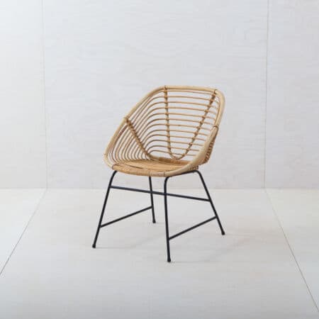 Rattan Chair Esquina | The Esquina chair is a filigree rattan chair made of bamboo. We often rent the rattan chair for a lounge setting or an event in the garden. Rattan chair Esquina is an eye-catcher and together with the wicker chair Frontera results in a beautiful ensemble. | gotvintage Rental & Event Design